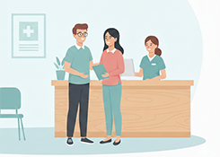 Two people standing in a clinic reception area and holding a folder, with a smiling receptionist behind the desk in the background.